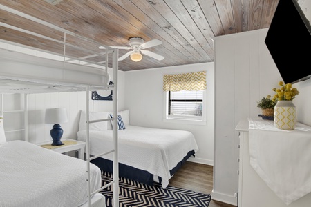 Bedroom 2 has a Queen bed and Twin Bunk