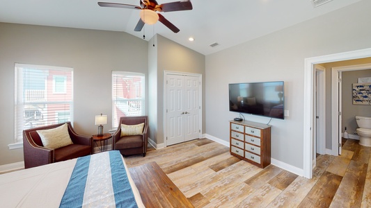 Bedroom 3 comes with a television, ceiling fan and shares the hall bathroom