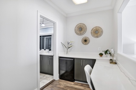 Work area and small beverage fridge in bedroom 7