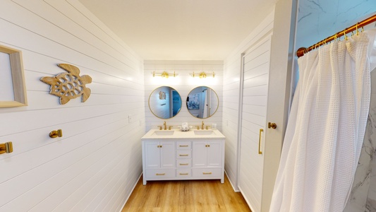 The master bedroom has a private bathroom with a double vanity