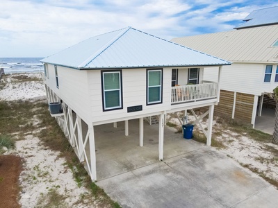 Covered parking and paved driveway