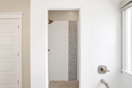 Beautiful tiled walk-in shower in the master bath