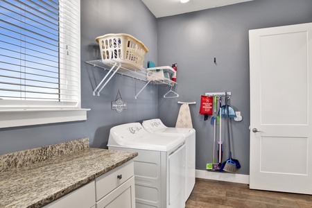 1st floor laundry room with full size washer/dryer and fridge