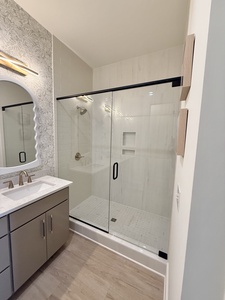 Featuring a walk-in tile shower