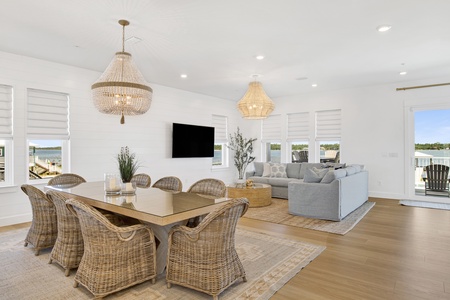 The living room offers a TV and balcony access