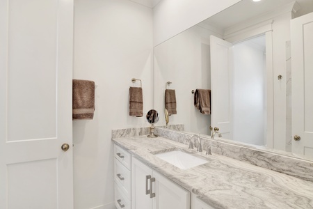 The private bath in Bedroom 4 has a walk-in shower