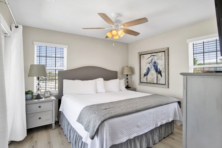 The primary bedroom offers balcony access and private bathroom