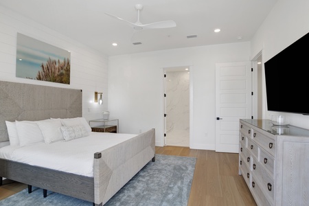 The master bedroom offers a TV and King bed, sleeps 2