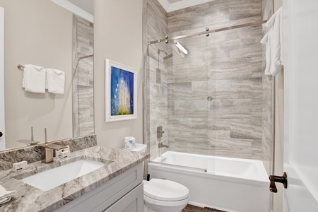 2nd floor guest bathroom  with a tub/shower combo