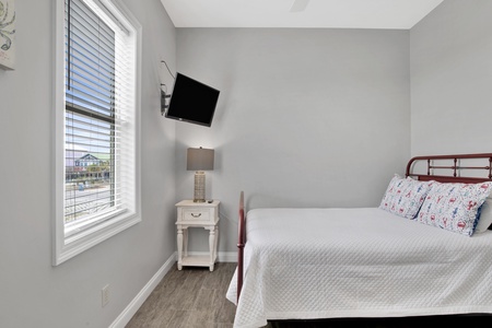 2nd floor Bedroom 3 has a queen bed and a TV