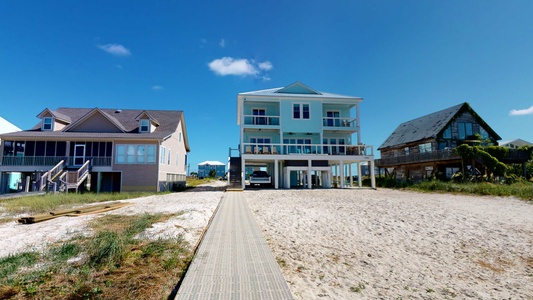 Under the home guests will find covered parking, a picnic table and a swing