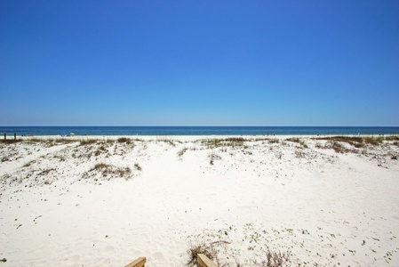 Private beach area in front of the home