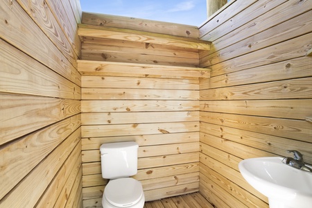 Private, outdoor bathroom located in the carport