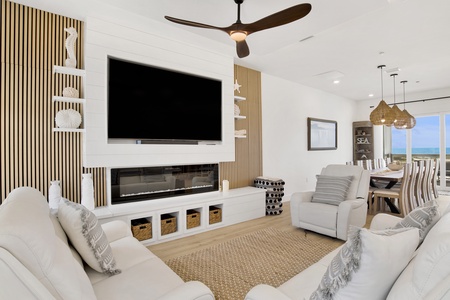 The living room features a TV and fireplace