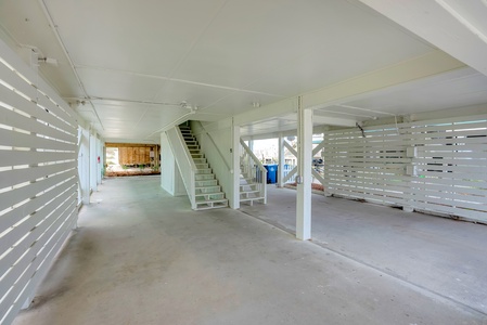 Covered parking in the carport with additional parking in the driveway