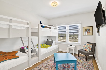Guest bedroom 3 offers 2 sets of custom XL Twin bunk beds and a TV
