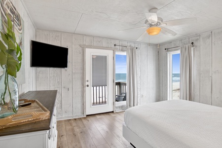The master bedroom has beautiful views of the gulf, a private balcony and TV