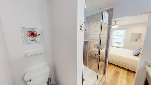 The Master bath has a private toilet area and a walk-in shower