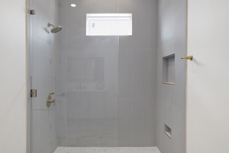 Featuring a walk-in tile shower