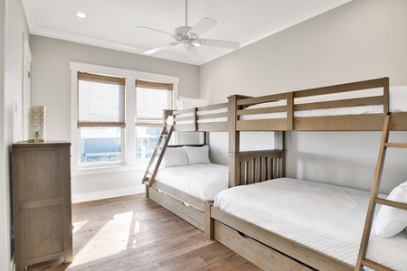 The bunk room sleeps 8 with 2 sets of twin over full bunk beds and 2 twin trundles
