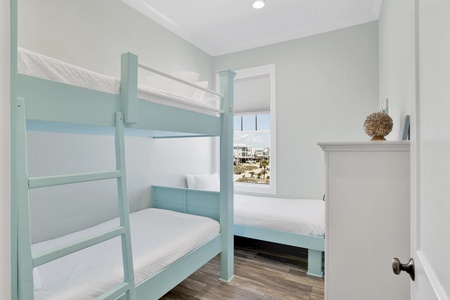 Guest bedroom with 1 twin bunk and 1 single twin, sleeping 3