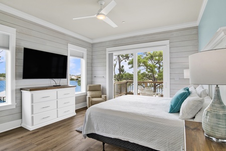 The primary bedroom offers a private bathroom, balcony access, TV and King bed, sleeps 2