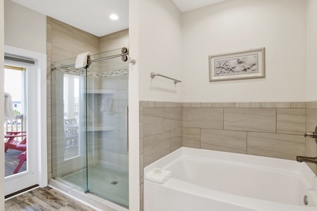 Master bath offers walk-in shower and soaking tub