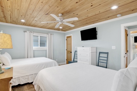 Guest bedroom 2 offers two queen beds, sleeping 4 guests