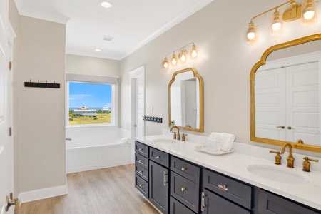 The private bathroom has double vanities, soaking tub