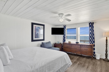 The master bedroom has a TV and an amazing view