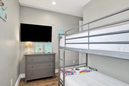 Bedroom 7 features 2 sets of Twin bunk beds and a TV