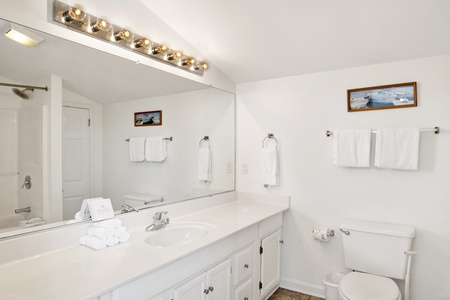 The loft bathroom has a tub/shower combo and extra counterspace