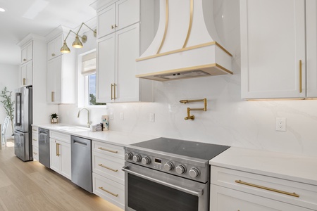 Gorgeous kitchen with stone counters and stainless appliances