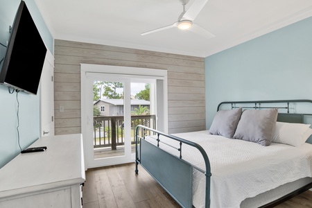 Bedroom 4 offers balcony access, TV and Queen bed, sleeps 2