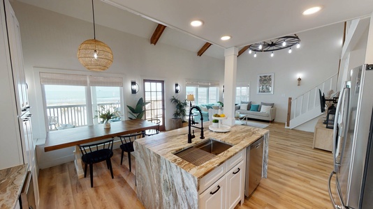 Kitchen, dining room, and living room all together