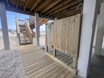 New boardwalk stairs leading to the outdoor shower