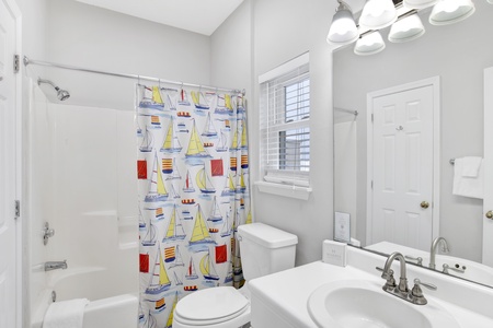 The attached bathroom features a tub/shower combo and is accessible from the hallway
