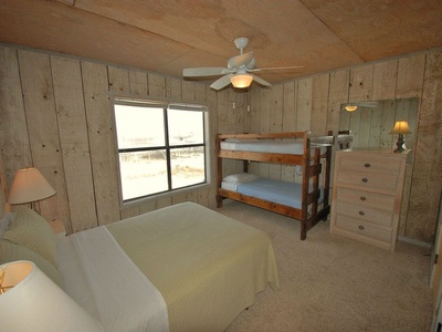 2nd level, bedroom 2, sleeps 4, queen bed, twin bunks, private bath
