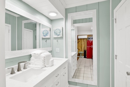 Full bathroom with a double vanity in the suite