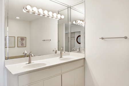 Private master bathroom with a double vanity