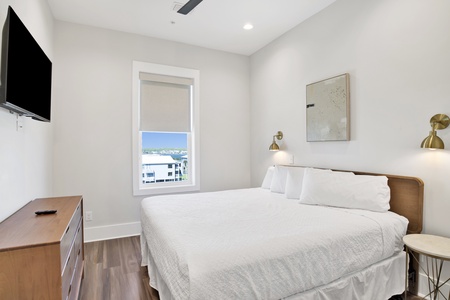 Bedroom #7 is on the 3rd floor with a king bed, TV and a private bathroom