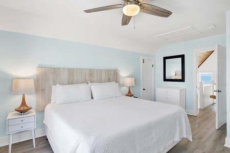 Upstairs master bedroom with kings size bed and a TV