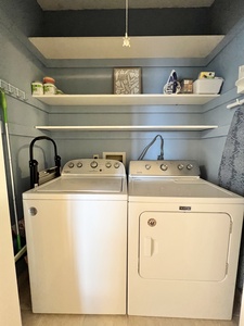 Full size washer and dryer in the hallway