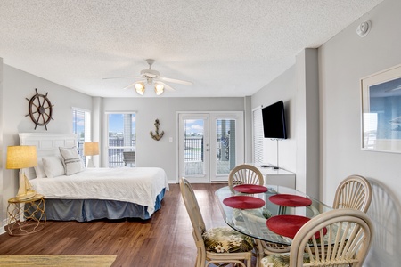 The downstairs apartment has a bed, TV, dining table, kitchen and more
