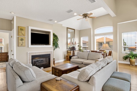 The living room features a flatscreen TV and plenty of room for gathering