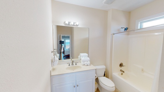 Private bath in Bedroom 1 with a tub/shower combo