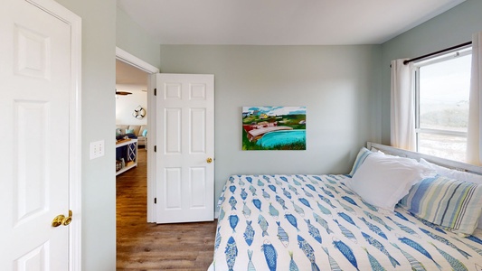 Queen bed + Twin bunk bed, TV, shared hall bath with a tub/shower combo