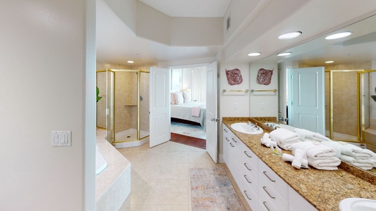 The master bath comes with a double vanity, walk-in shower and a jetted tub