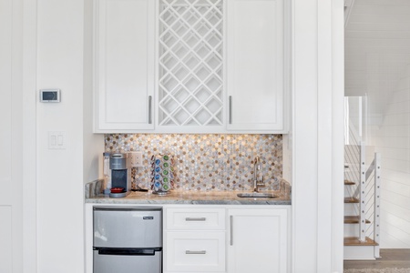 Wet bar with a sink, pod coffee maker and a mini-fridge