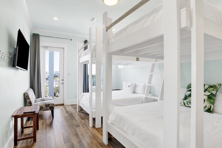 Bedroom 3 offers two sets of Queen bunk beds, TV, balcony access and private bathroom